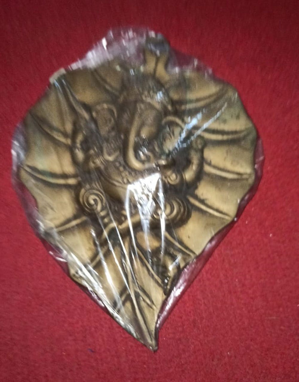 Ganapathi On Leaf Carved In Brass Metal